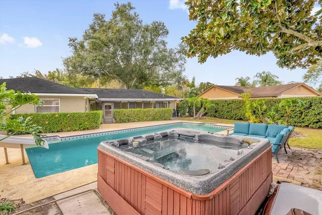a view of a swimming pool with a yard