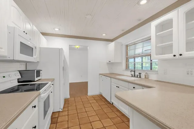 a spacious bathroom with a sink a mirror and a shower