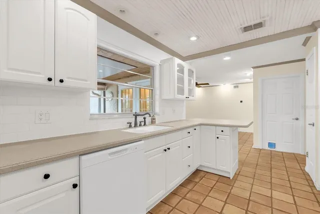 a living room with furniture a rug and a table