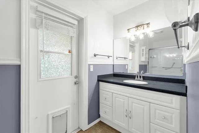 a bathroom with a shower a toilet and sink