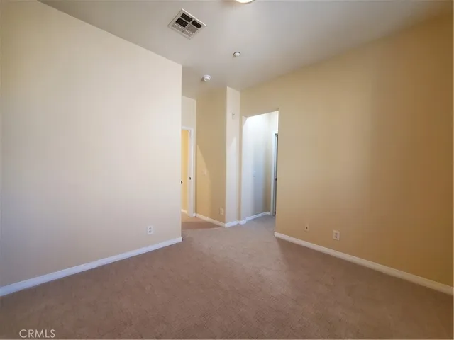 a bathroom with a toilet sink and a mirror