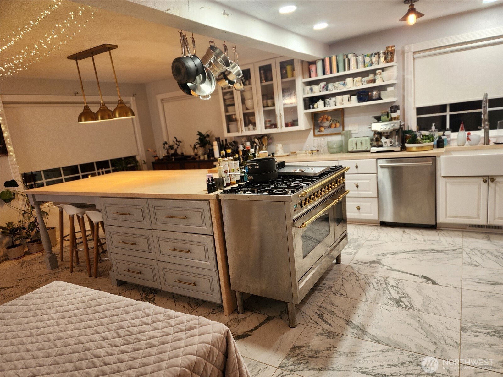 6217 Lackey Road Northwest Vaughn, WA 98394 - Photo 12 of 26 a kitchen with a stove and a cabinets