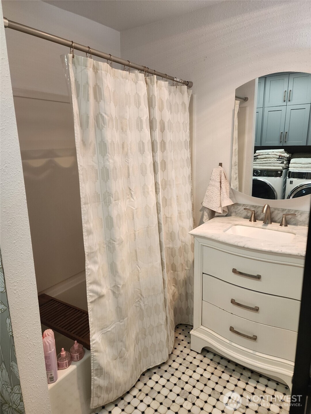 6217 Lackey Road Northwest Vaughn, WA 98394 - Photo 16 of 26 a bathroom with a sink and a mirror