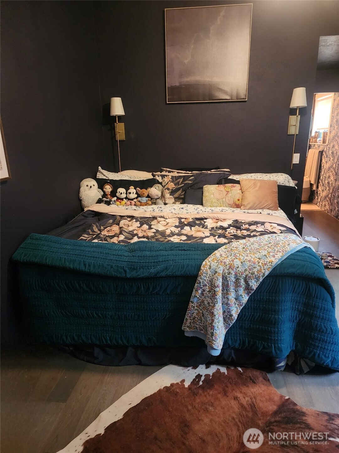 6217 Lackey Road Northwest Vaughn, WA 98394 - Photo 23 of 26 a bed sitting in a bedroom next to a lamp