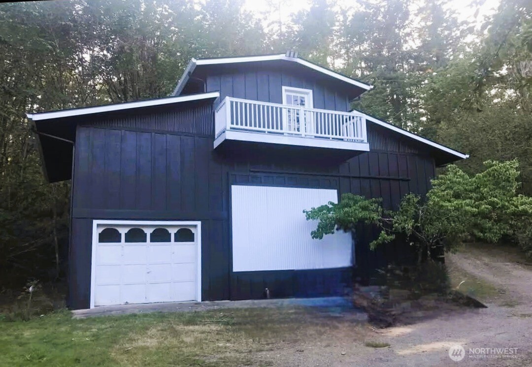 6217 Lackey Road Northwest Vaughn, WA 98394 - Photo 25 of 26 a front view of a house with garden
