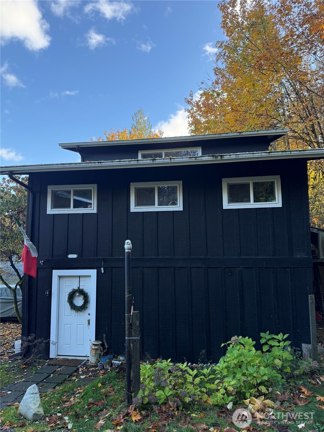 6217 Lackey Road Northwest Vaughn, WA 98394 - Photo 26 of 26 a front view of a house with a garden