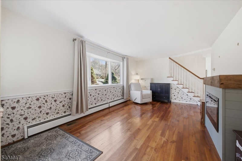 23 Lingert Avenue Clinton, NJ 08809 - Photo 13 of 43 a view of a livingroom with wooden floor and cabinet