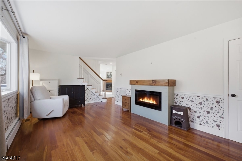 23 Lingert Avenue Clinton, NJ 08809 - Photo 14 of 43 a living room with furniture and a fireplace