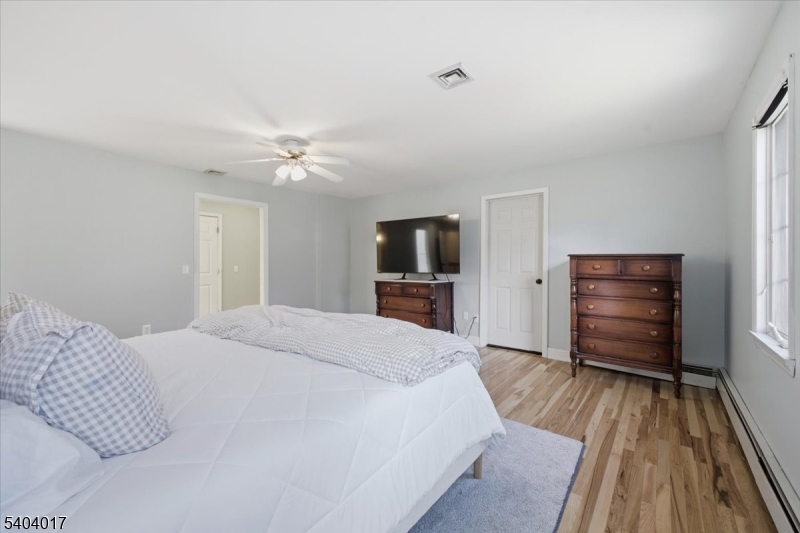 23 Lingert Avenue Clinton, NJ 08809 - Photo 23 of 43 a bedroom with a bed and a television