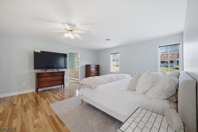 23 Lingert Avenue Clinton, NJ 08809 - Photo 25 of 43 a bedroom with a bed and a flat screen tv