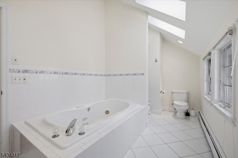 23 Lingert Avenue Clinton, NJ 08809 - Photo 27 of 43 a bathroom with a bathtub and a toilet