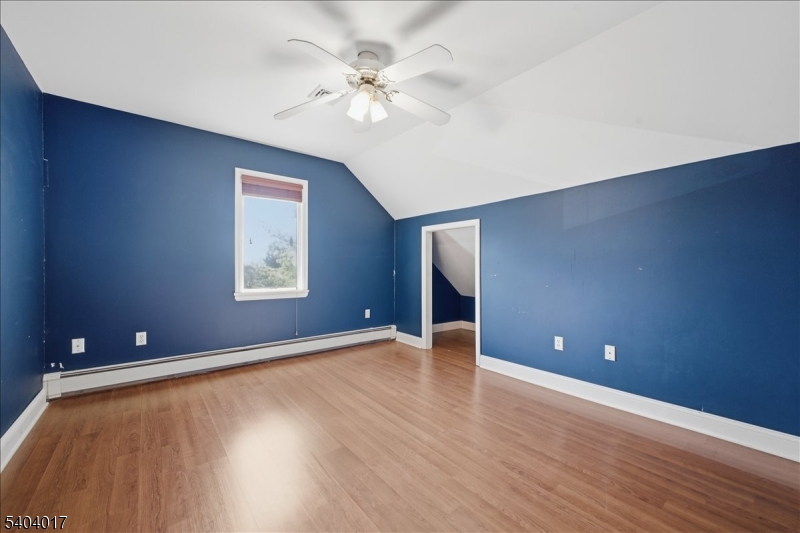 23 Lingert Avenue Clinton, NJ 08809 - Photo 32 of 43 a view of an empty room with window and wooden floor