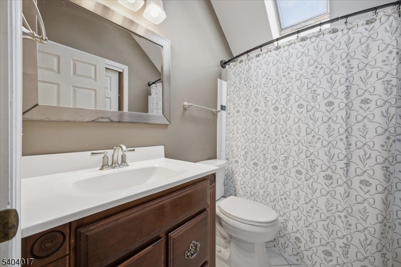 23 Lingert Avenue Clinton, NJ 08809 - Photo 34 of 43 a bathroom with a sink a toilet and a mirror