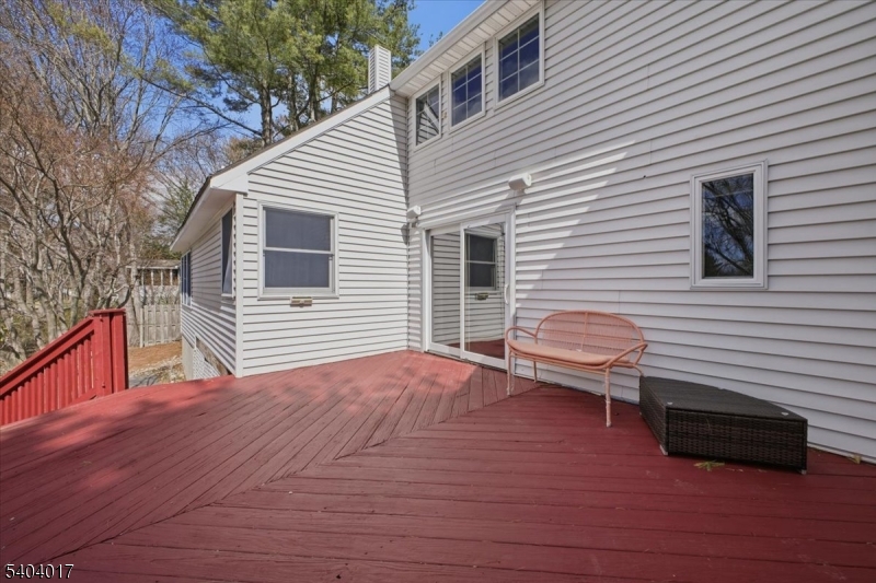 23 Lingert Avenue Clinton, NJ 08809 - Photo 36 of 43 a backyard of a house with wooden deck and furniture