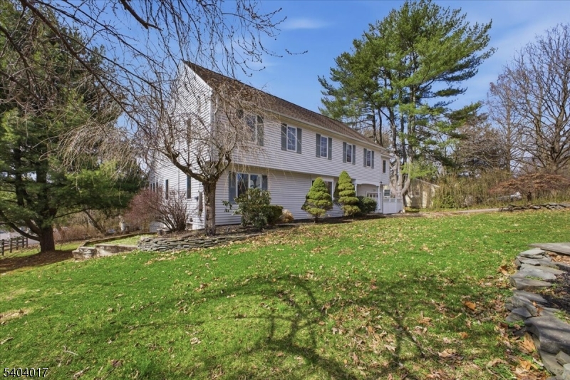 23 Lingert Avenue Clinton, NJ 08809 - Photo 39 of 43 a front view of a house with garden