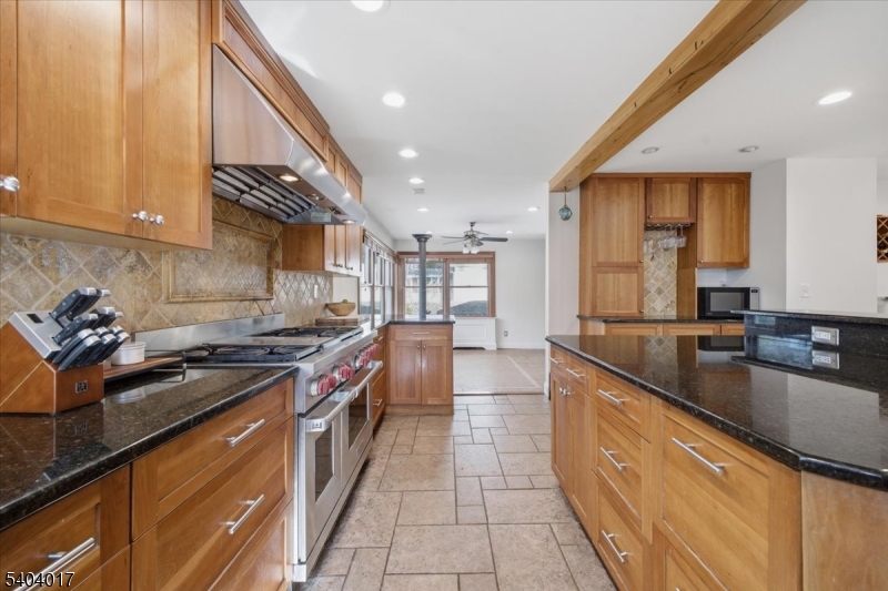 23 Lingert Avenue Clinton, NJ 08809 - Photo 5 of 43 a kitchen with stainless steel appliances granite countertop a sink a stove and a refrigerator