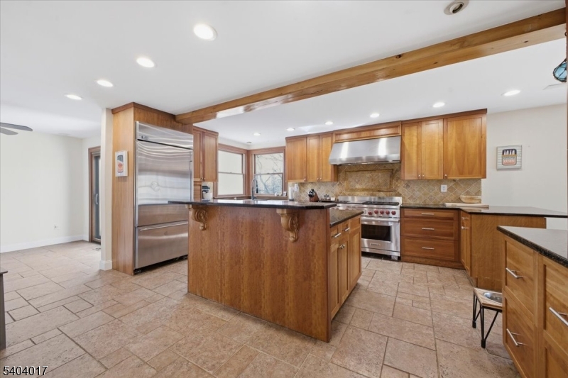 23 Lingert Avenue Clinton, NJ 08809 - Photo 6 of 43 a kitchen with stainless steel appliances granite countertop a refrigerator and a stove top oven