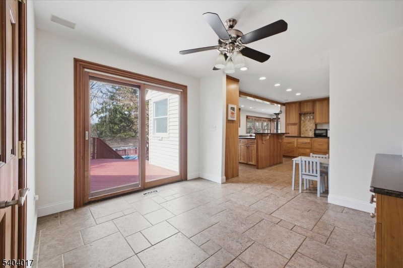 23 Lingert Avenue Clinton, NJ 08809 - Photo 7 of 43 a view of a livingroom with furniture and a ceiling fan