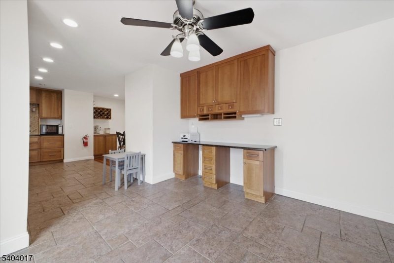 23 Lingert Avenue Clinton, NJ 08809 - Photo 8 of 43 a view of kitchen with furniture and a ceiling fan