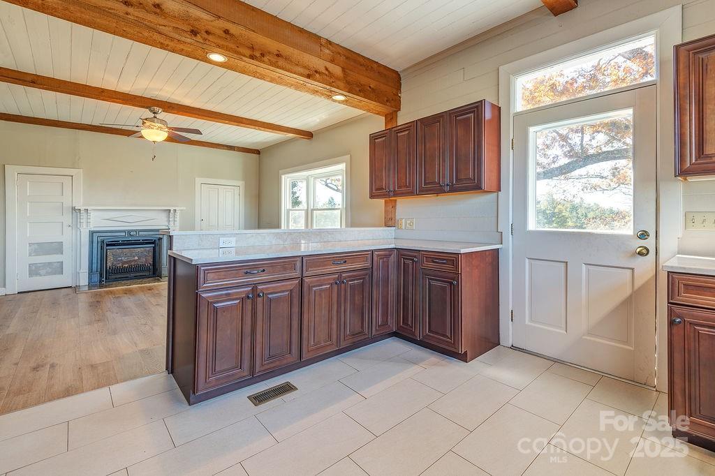 839 Jupiter Road Weaverville, NC 28787 - Photo 13 of 43 a kitchen with stainless steel appliances granite countertop a stove a sink and a microwave