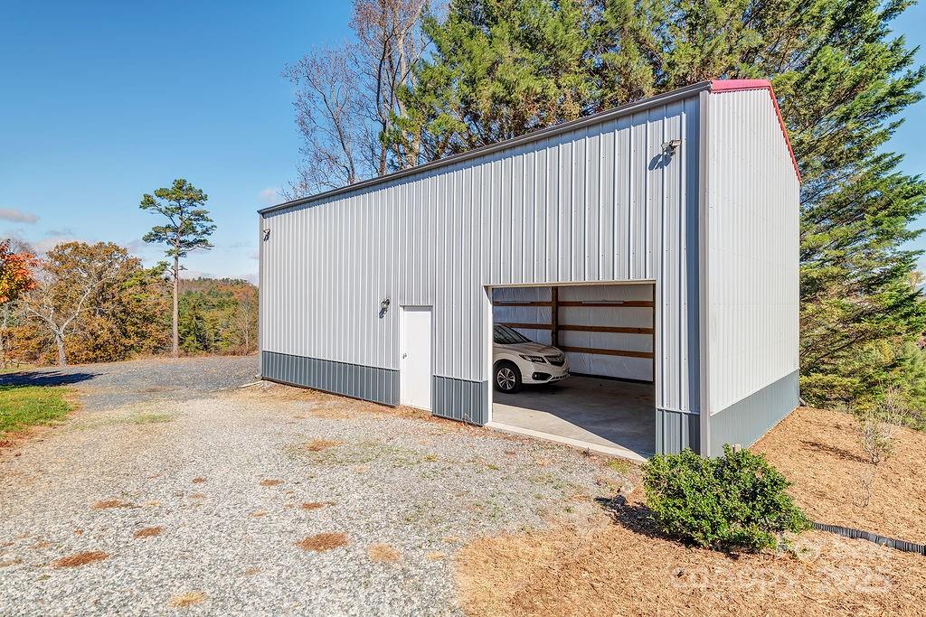 839 Jupiter Road Weaverville, NC 28787 - Photo 25 of 43 a view of a house with a backyard