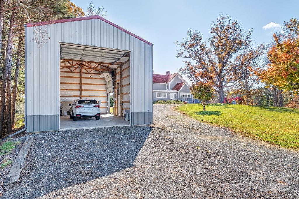 839 Jupiter Road Weaverville, NC 28787 - Photo 26 of 43 a view of a house with a yard