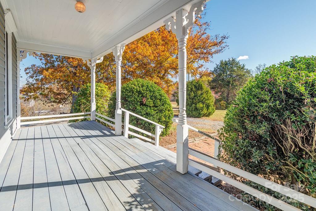 839 Jupiter Road Weaverville, NC 28787 - Photo 3 of 43 a view of balcony with floor to ceiling windows with wooden floor