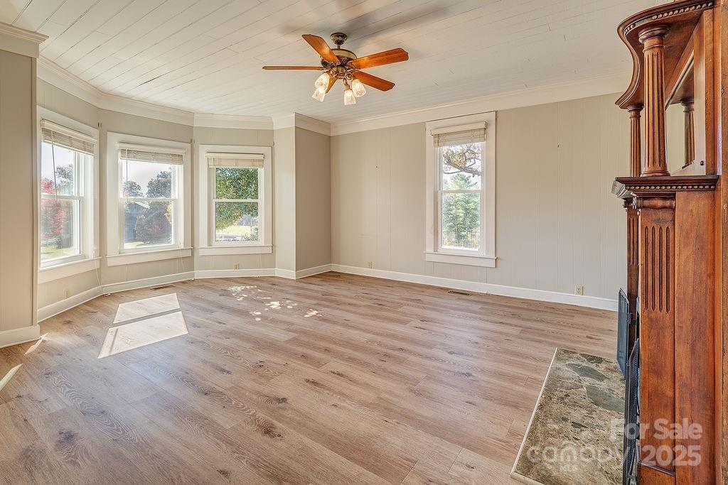839 Jupiter Road Weaverville, NC 28787 - Photo 6 of 43 wooden floor chandelier and windows in a room
