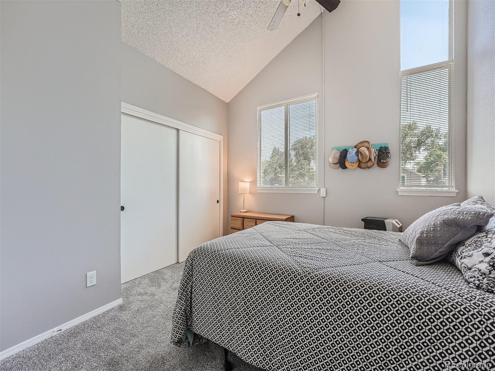 4911 Garrison Street, Unit 202G Wheat Ridge, CO 80033 - Photo 14 of 33 a bedroom with a bed and a window