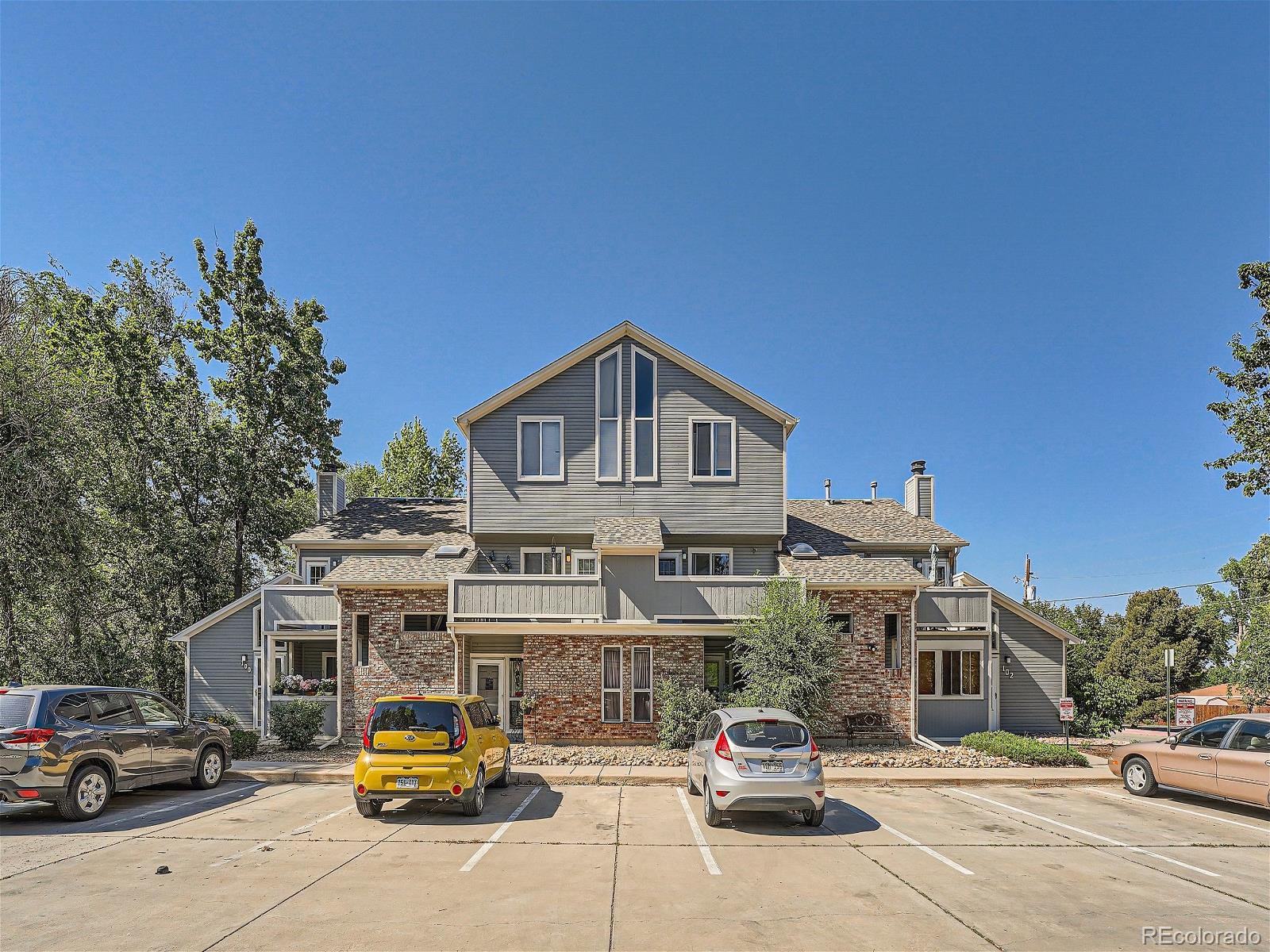 4911 Garrison Street, Unit 202G Wheat Ridge, CO 80033 - Photo 2 of 33 a car parked in front of building