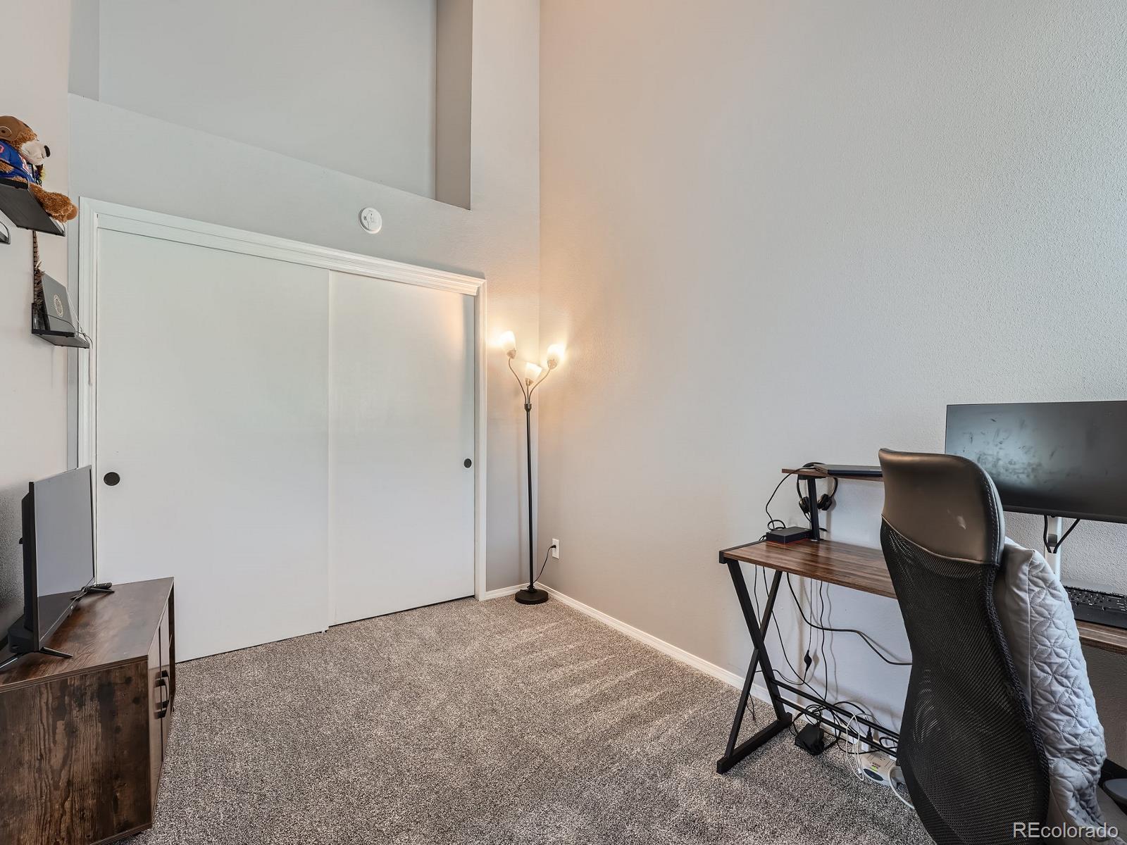 4911 Garrison Street, Unit 202G Wheat Ridge, CO 80033 - Photo 24 of 33 a view of a workspace with furniture and a window