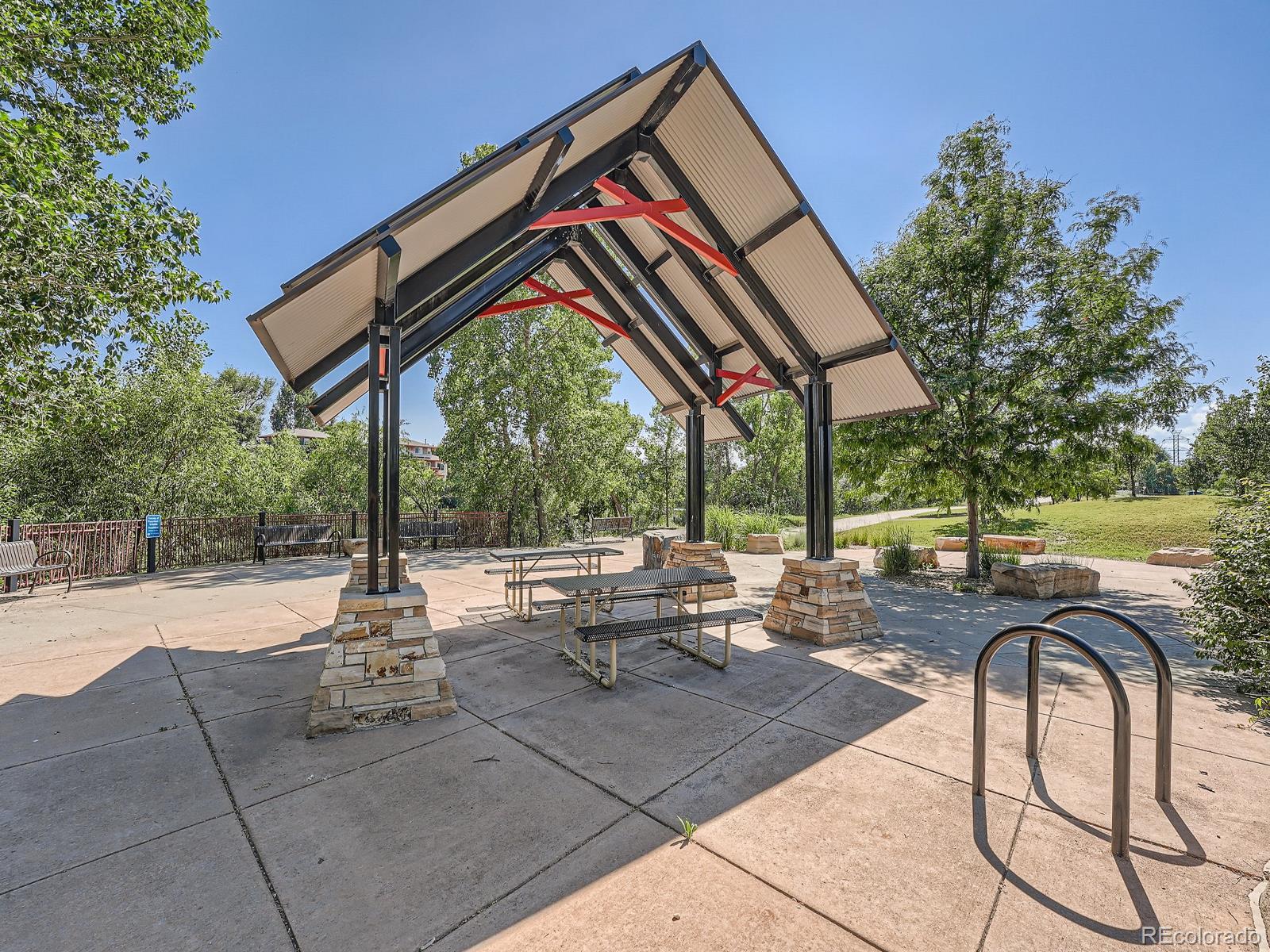 4911 Garrison Street, Unit 202G Wheat Ridge, CO 80033 - Photo 32 of 33 a view of swimming pool with outdoor seating and plants