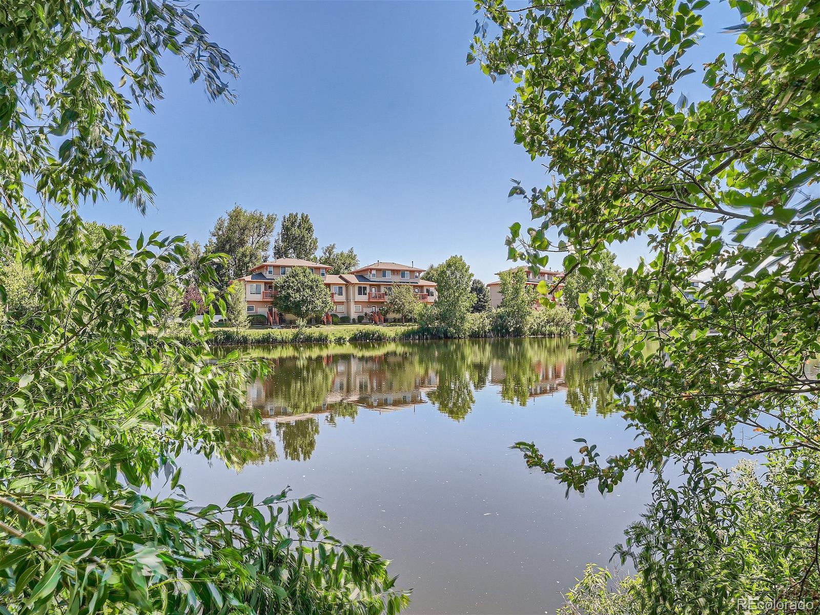 4911 Garrison Street, Unit 202G Wheat Ridge, CO 80033 - Photo 33 of 33 a view of a lake with a lake