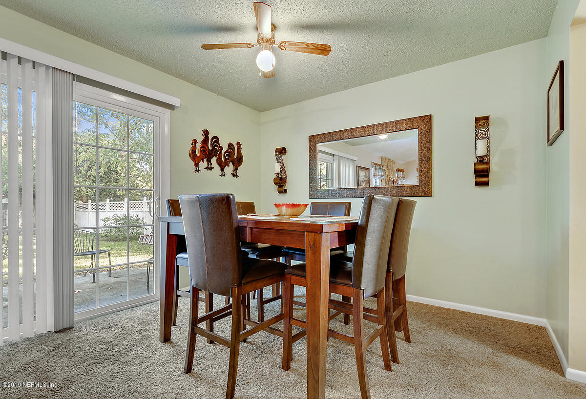 12819 Beaubien Road Jacksonville, FL 32258 - Photo 11 of 17 a view of a dining room with furniture window and outside view