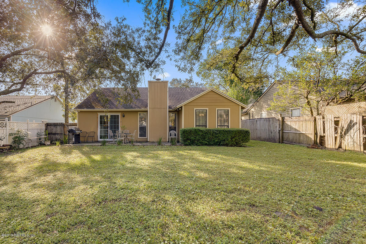 12819 Beaubien Road Jacksonville, FL 32258 - Photo 16 of 17 a front view of a house with a garden
