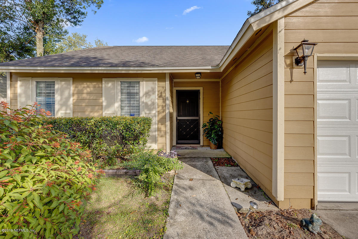 12819 Beaubien Road Jacksonville, FL 32258 - Photo 2 of 17 a front view of a house with a yard