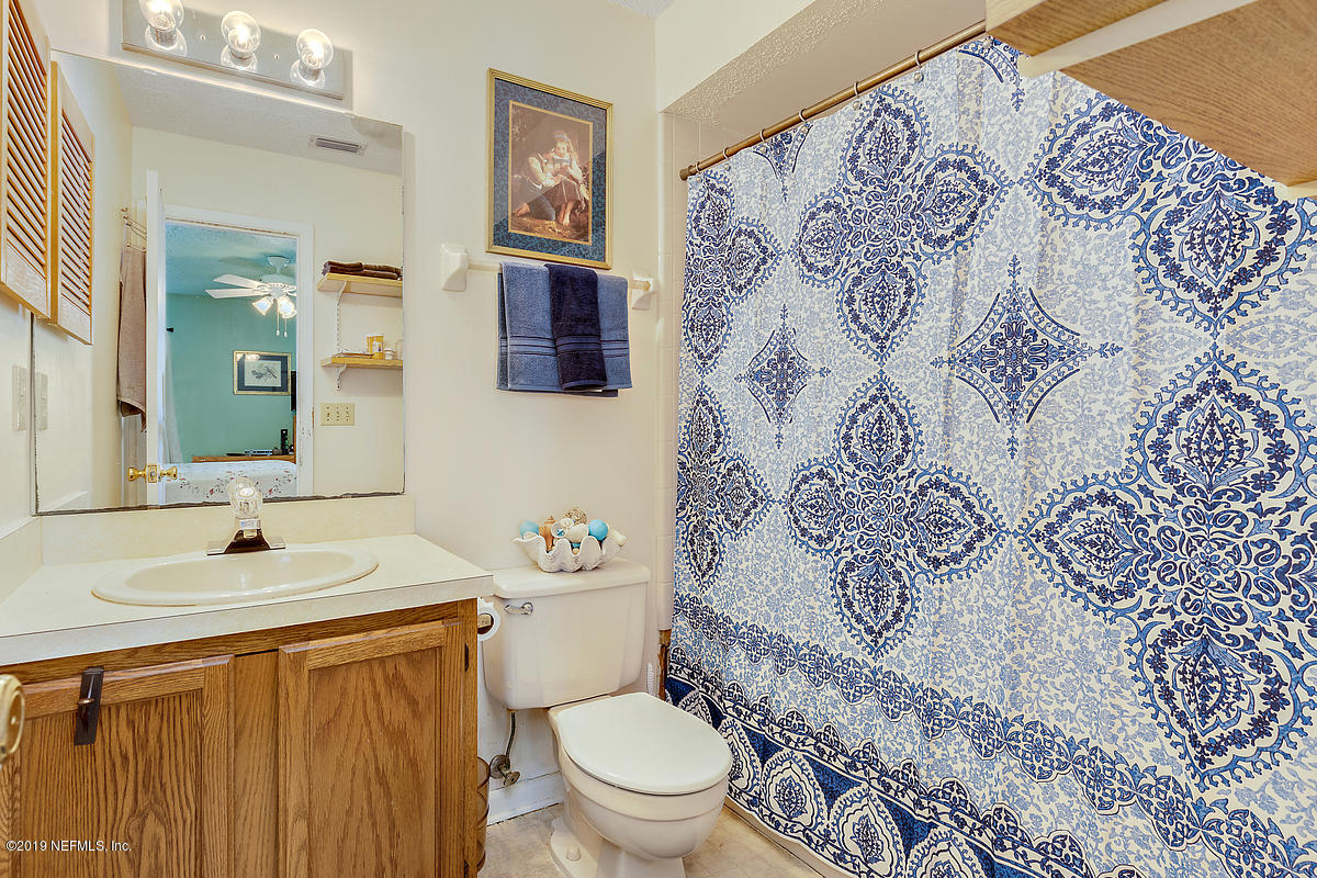 12819 Beaubien Road Jacksonville, FL 32258 - Photo 8 of 17 a bathroom with a sink and a mirror