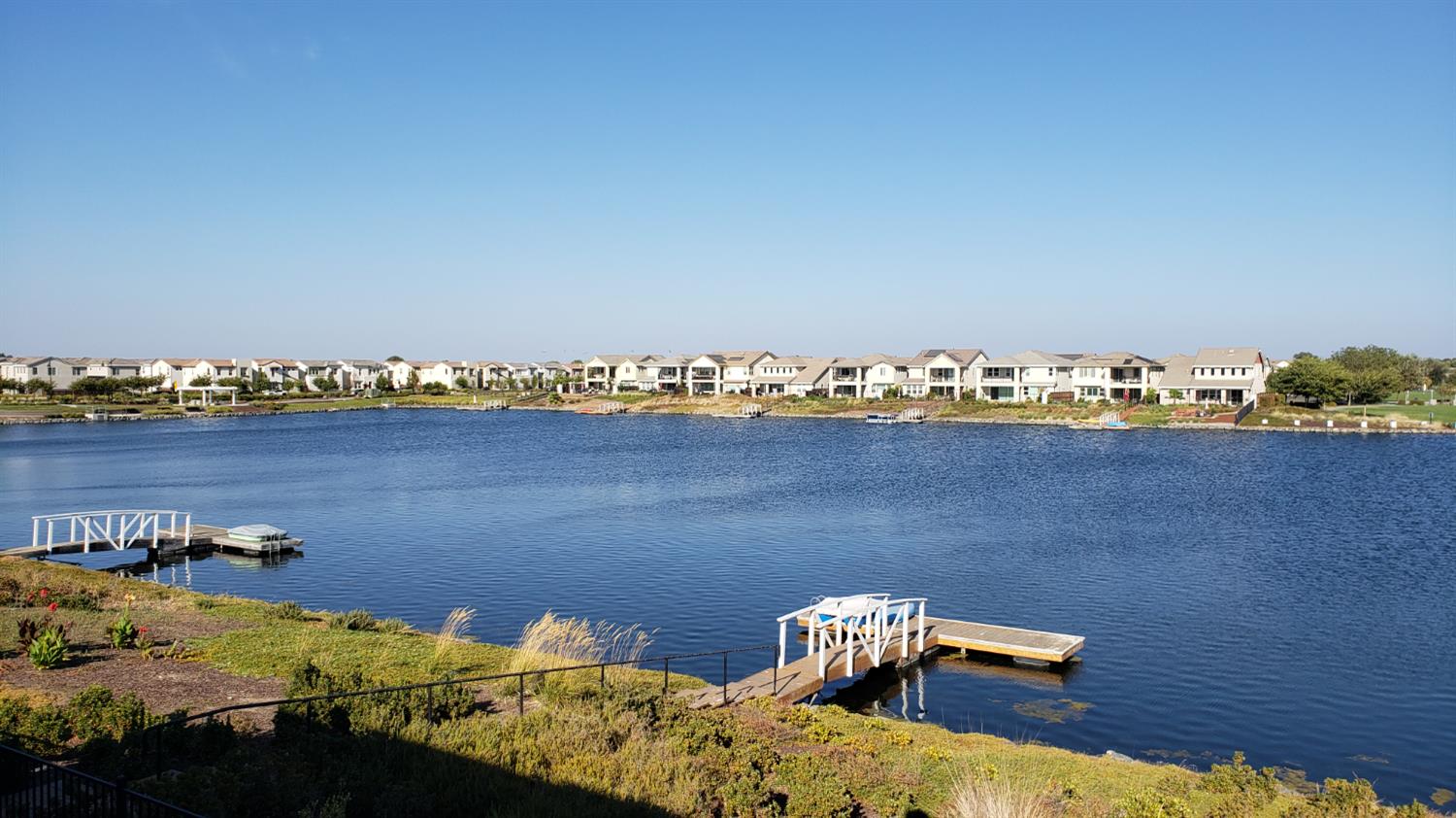 18006 Silver Springs Way Lathrop, CA 95330 - Photo 2 of 26 an aerial view of a houses with a lake