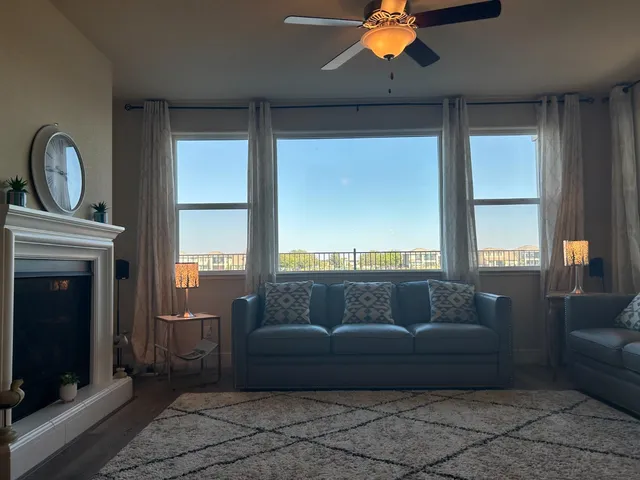 a living room with furniture and a fireplace