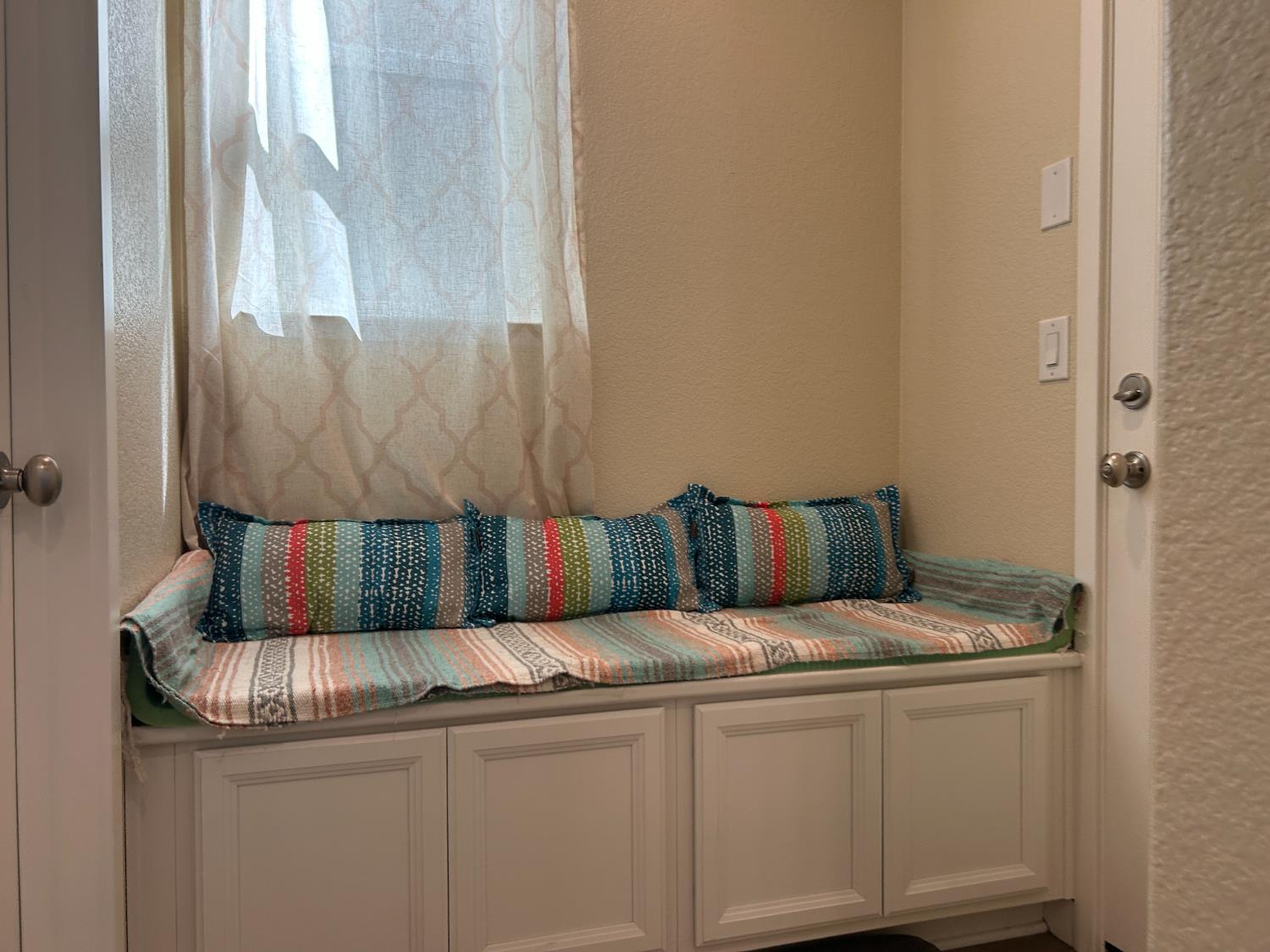 18006 Silver Springs Way Lathrop, CA 95330 - Photo 9 of 26 a bed sitting in a kitchen next to a window