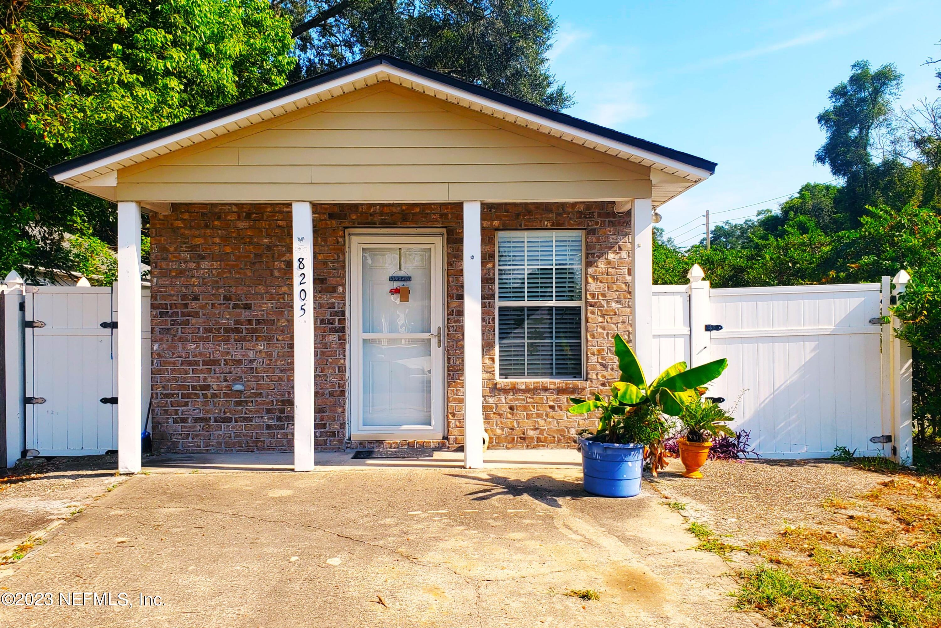 8205 Firetower Road Jacksonville, FL 32210 - Photo 1 of 11 a view of a house with a yard