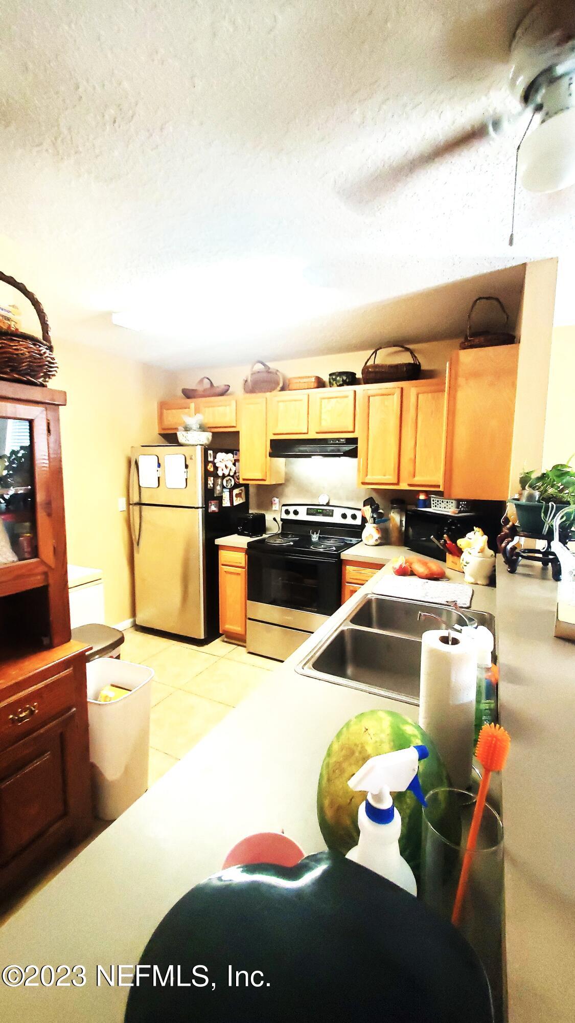 8205 Firetower Road Jacksonville, FL 32210 - Photo 11 of 11 a view of a swimming pool with furniture