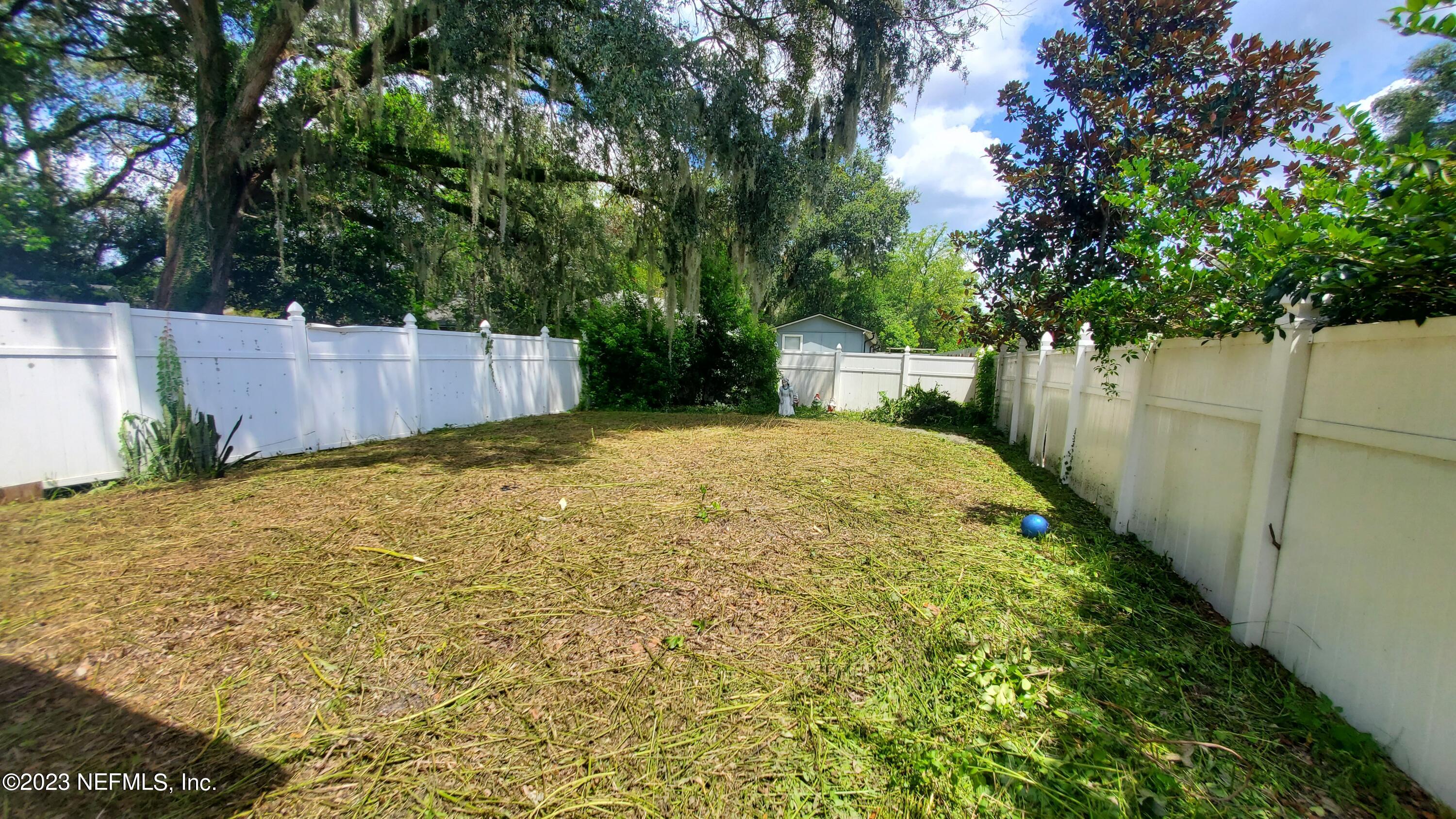 8205 Firetower Road Jacksonville, FL 32210 - Photo 3 of 11 a view of a backyard