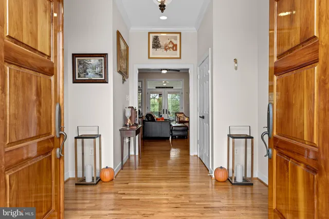 a living room with furniture a flat screen tv and a large window