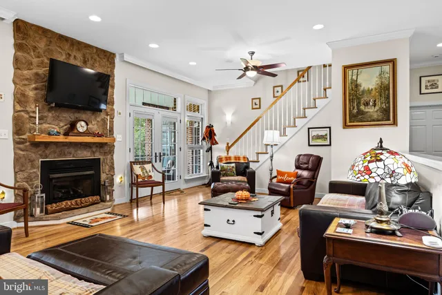 a kitchen with stainless steel appliances kitchen island granite countertop a sink and cabinets