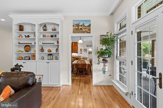 a kitchen with granite countertop a sink a stove and cabinets