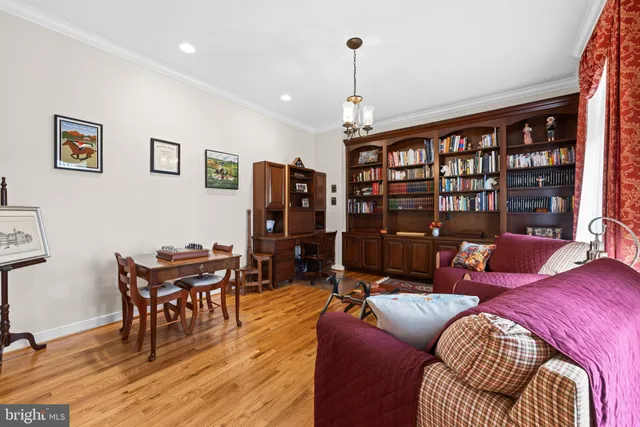 a white toilet sitting next to a sink next to a window