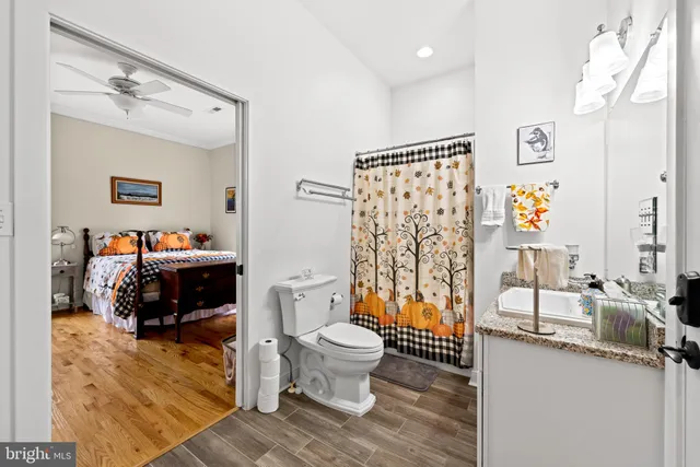 a bathroom with a sink a mirror and shower