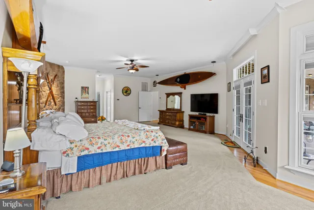 a bedroom with furniture and a window