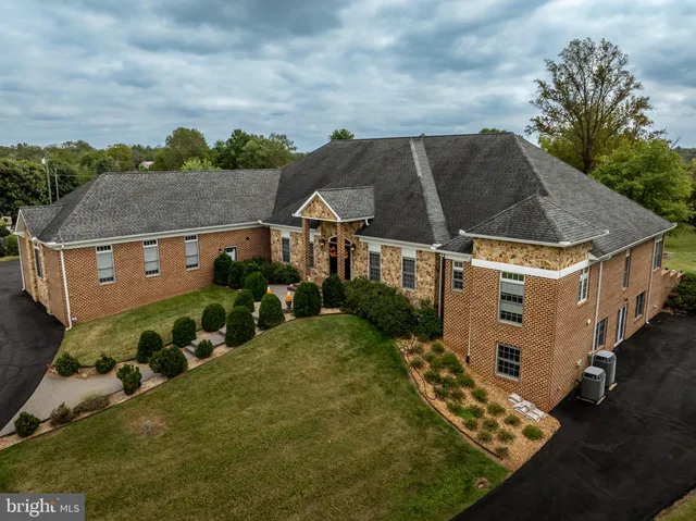 a view of a patio with table and chairs